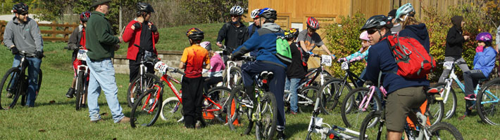 Bike patrollers getting ready to take kids out on a group ride at the annual Take A Kid Mountain Biking Day in St. Charles county. Bike Patrol Log - Volunteer Hours Form